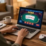 Engaging in GO88 online poker gameplay at a cozy home setup.